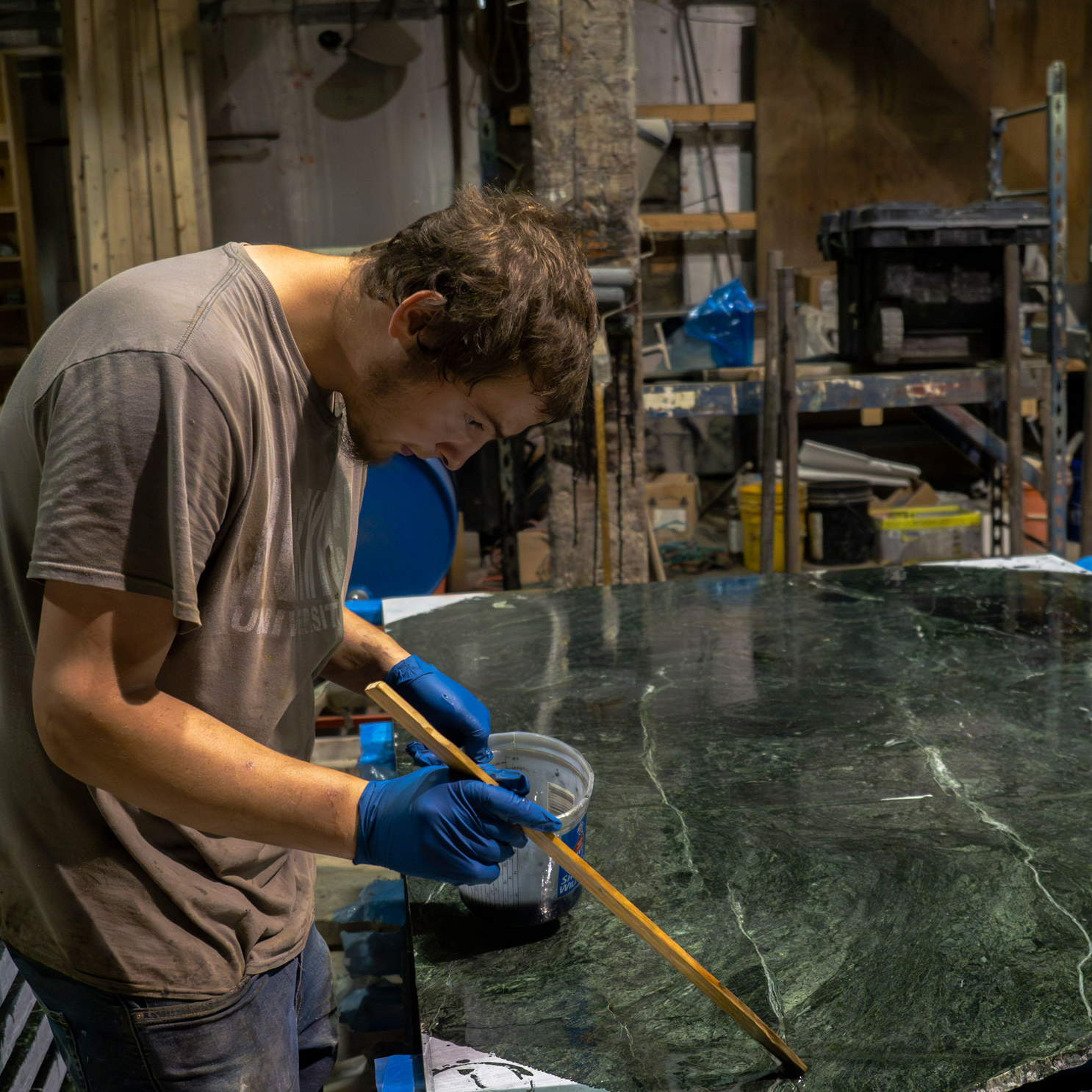 Resining strengthens Vermont Verde green marble by filling tiny fissures along the quartz veining to increase the stone's resistance and durability.