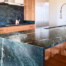 Waterfall style kitchen island in stunning Vermont Verde Serpentine