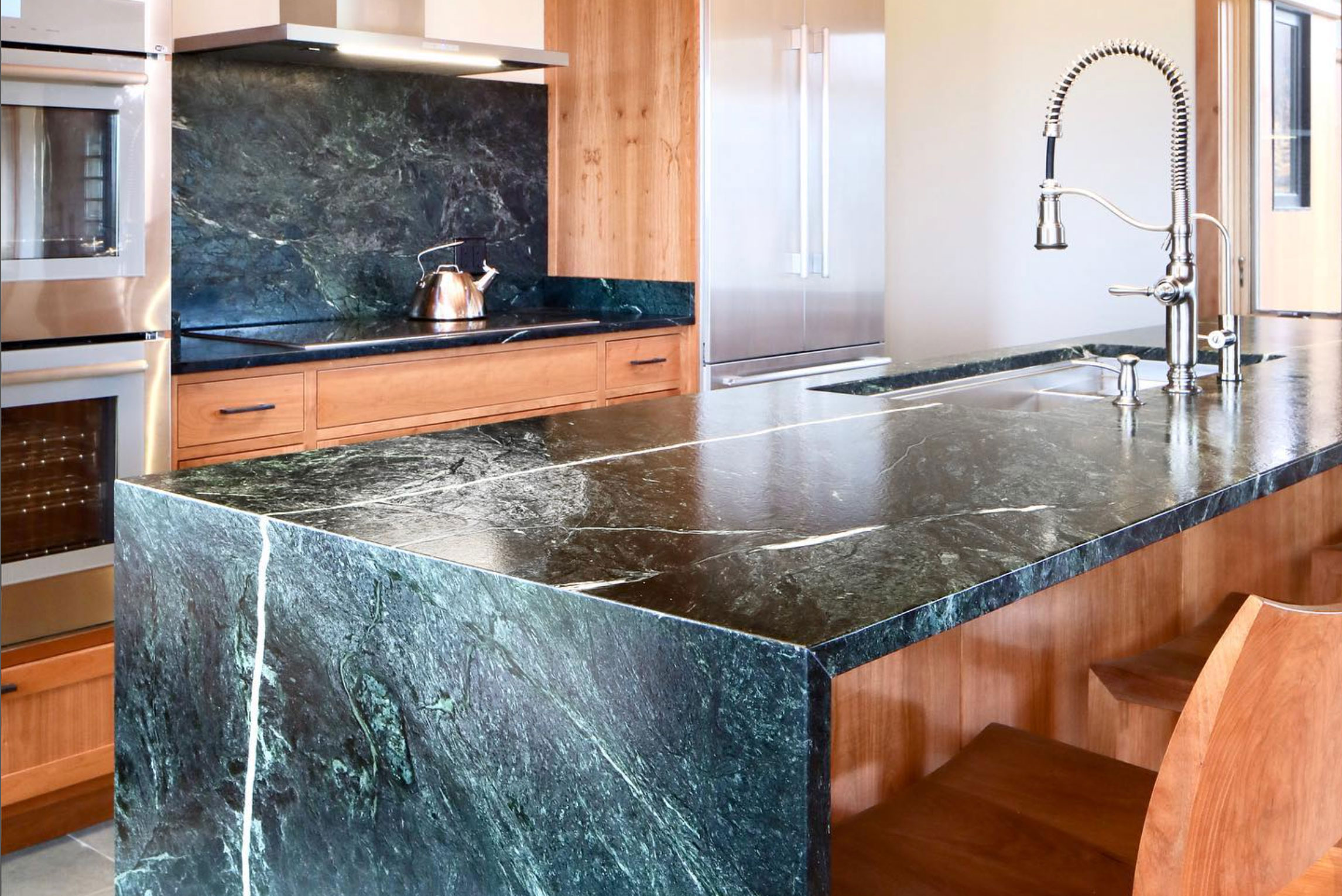 Waterfall style kitchen island in stunning Vermont Verde Serpentine